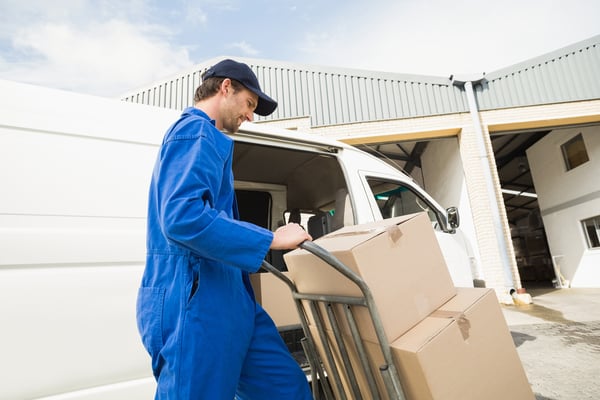 courier pushing parcels